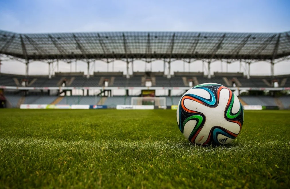 Soccer Ball on Grass Field during Daytime